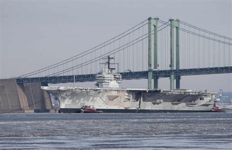 USS Forrestal (CV-59) is towed under the Delaware Memorial Bridge on ...