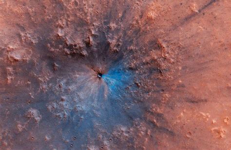 A weird glowing light and a new crater have been discovered on Mars in ...