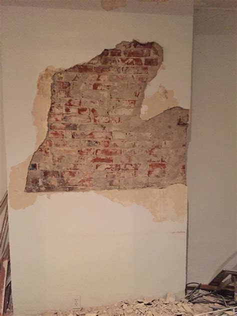 walls - How do I cover up this partially exposed brick? - Home ...