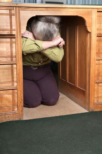 Woman Hiding Under A Desk Stock Photo - Download Image Now - iStock