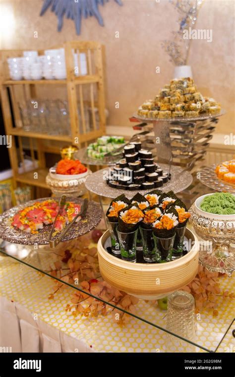 Japanese food rolls and sushi in restaurant at buffet Stock Photo - Alamy