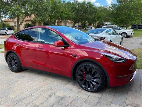 Red Model Y with black accents looks great - TeslaLounge | Tesla model x, Tesla suv, Black accents