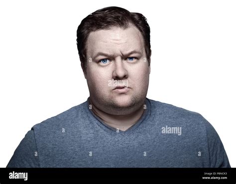 Close-up portrait of white Caucasian big fat stout man with blue eyes looking directly in camera ...