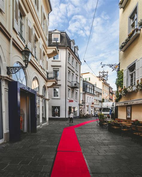 Red Carpet in the Middle of Road Between Buildings · Free Stock Photo