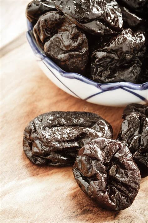 Dried Plums Prunes on Wooden Table Stock Image - Image of snack, fibre: 48145319