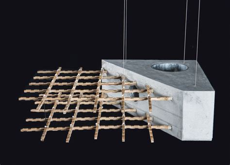 a concrete block with some sticks attached to it