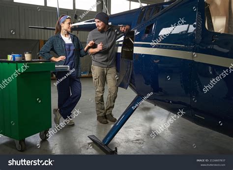 Happy Aviation Mechanic Team Uniform Repairing Stock Photo (Edit Now) 2116607837