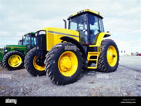 Yellow John Deere farm tractor many more agriculture related images available Stock Photo - Alamy