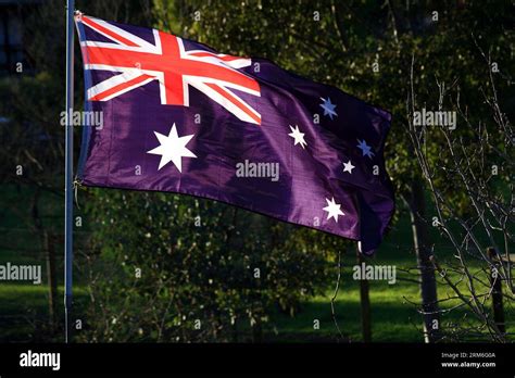 Australian blue ensign flag flying in a strong breeze Stock Photo - Alamy