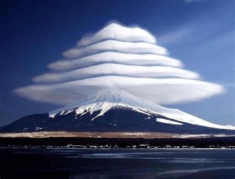 These are Lenticular Clouds. Lenticular clouds are stationary clouds ...