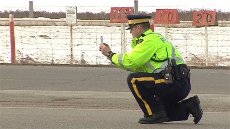 Gas tanker driver charged in rollover spill on QEII | CBC News