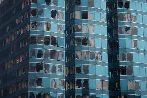 Damaged windows of the One Harbourfront office tower are seen following Typhoon Mangkhut, in ...