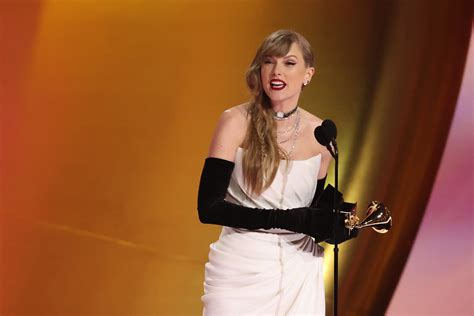 Grammys 2024: Taylor Swift makes history with fourth album of year win | Reuters