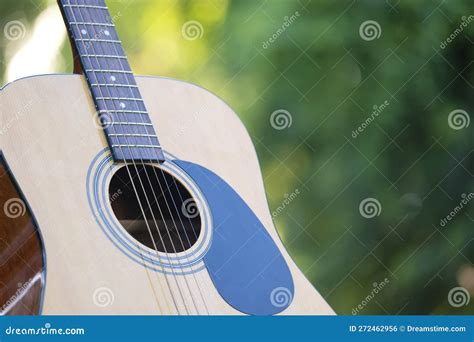 Acoustic Guitar Outdoors on Greenery Background. Concept of Calm Music ...