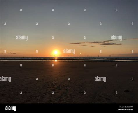 Sunset over New Brighton beach Stock Photo - Alamy