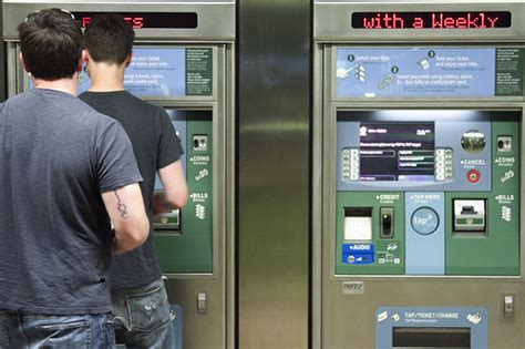 Customers purchasing fares at ticket vending machines (TVM… | Flickr