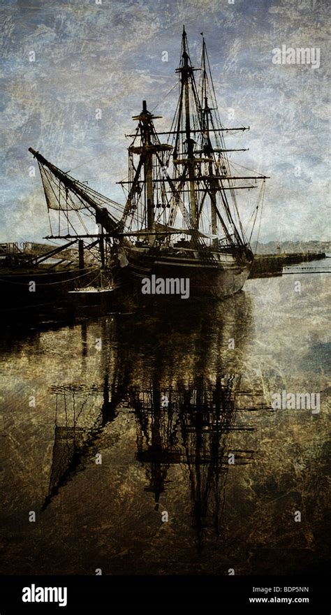 A three-masted sailing ship at dock Stock Photo - Alamy