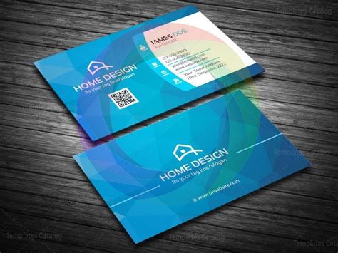 a blue business card with a house design on the front and back, sitting ...