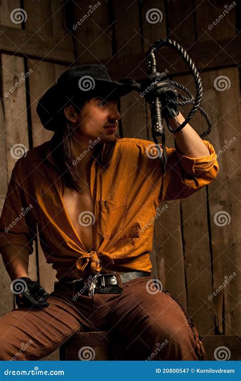 Cowboy Hat And Whip Resting On Fence Post - Horse In Background. Stock ...