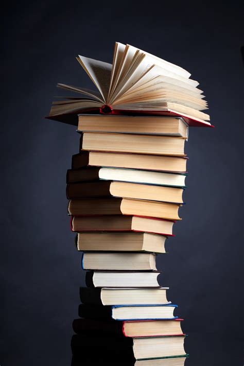 Pile of books on a black background by macinivnw on DeviantArt