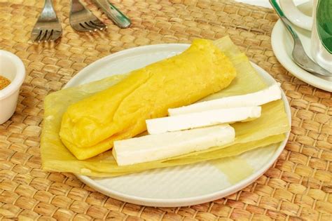 Premium Photo | Peruvianstyle salty humita tamale with cheese served on ...