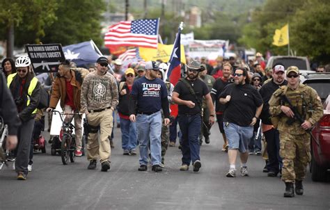 Gun-rights activists march through Olmos Park to protest police chief