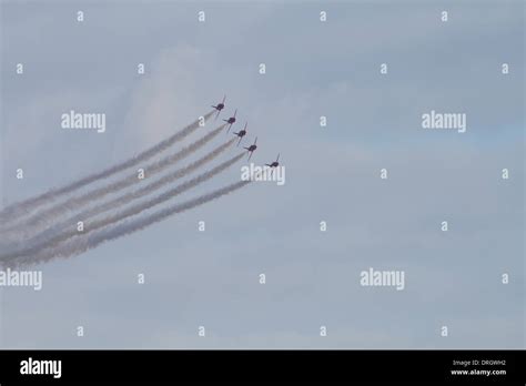 Five Red Arrows in Formation Stock Photo - Alamy