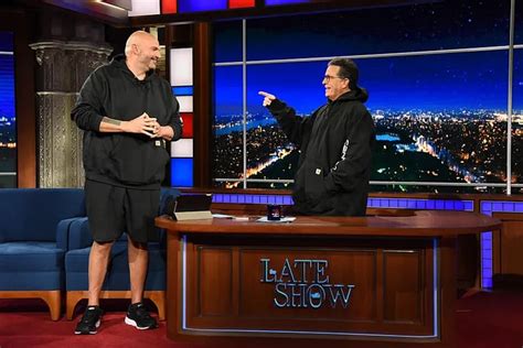 John Fetterman gifts Stephen Colbert his Carhartt hoodie on TV