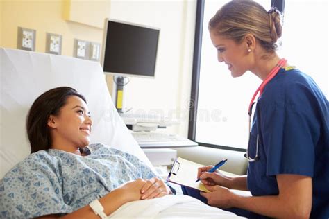 Nurse Talking To Female Patient on Ward Stock Photo - Image of horizontal, stethoscope: 35795978