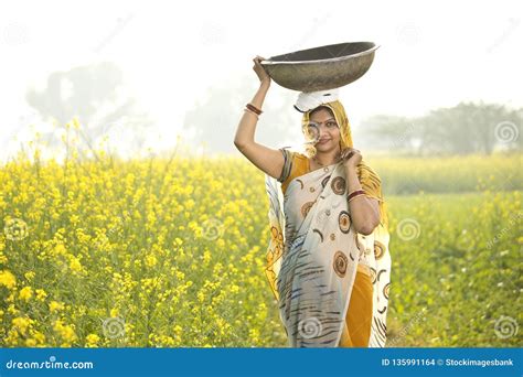 Female Indian Farmer Carrying Iron Pan on Head in Agriculture Field ...