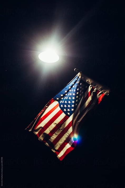 "American Flag Lit By A Streetlight At Night" by Stocksy Contributor ...