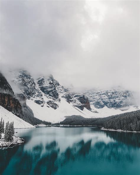 Rare glimpse of Moraine Lake in the winter [OC][2848x3560] : r/EarthPorn