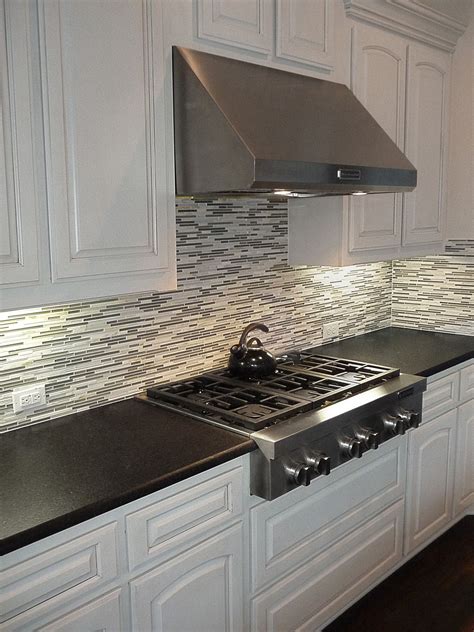 Black Pearl Leather Granite Countertops with a Mosaic backsplash and ...