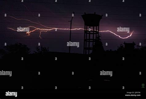 A lightning strikes at night Stock Photo - Alamy