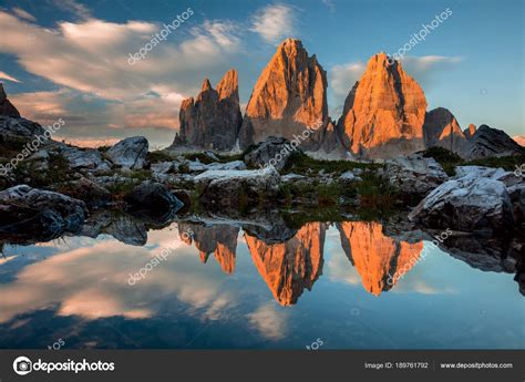 Tre Cime di Lavaredo with reflection in lake at sundown, Dolomit ...