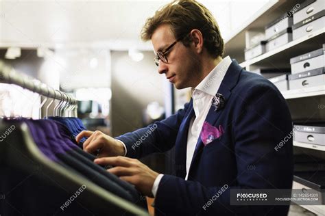 Salesman analyzing suits — Sales Occupation, businessman - Stock Photo ...