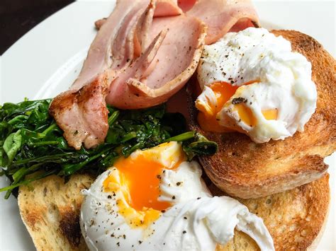 Poached eggs on toast with bacon and spinach at The Italia… | Flickr