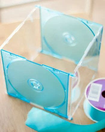 two cds are in clear cases on a table