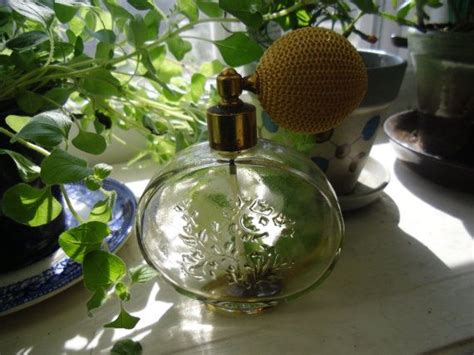 perfume atomizer collection on vanity display Avon Perfume, Perfume ...