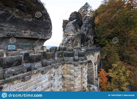 Side View of the Bastei Bridge with Rock Formations and Trees Stock ...