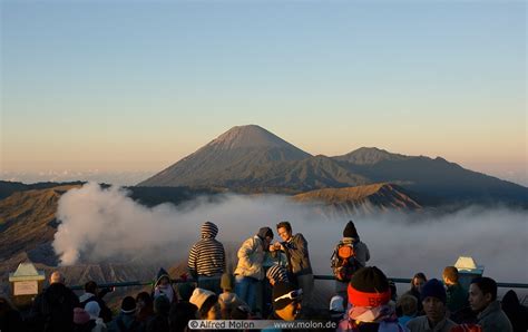 Tourists experiencing Mt Bromo sunrise on Mount Penanjakan picture. Tengger caldera at sunrise ...