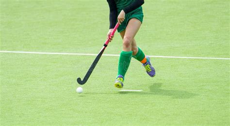 Young Hockey Player Woman with Ball in Attack Playing Field Hockey Game ...