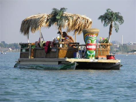 a pontoon boat that looks like a tiki bar. | Pontoon boat party, Boat party, Party barge