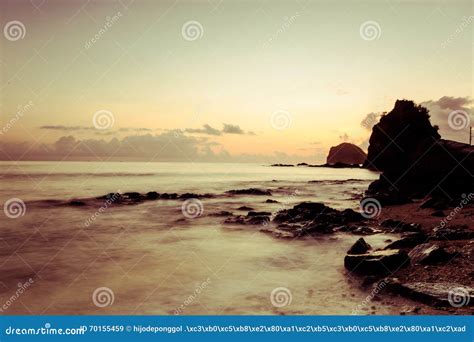 Watching Sunrise and Rock Formation at the Shore Stock Image - Image of outdoor, landscape: 70155459