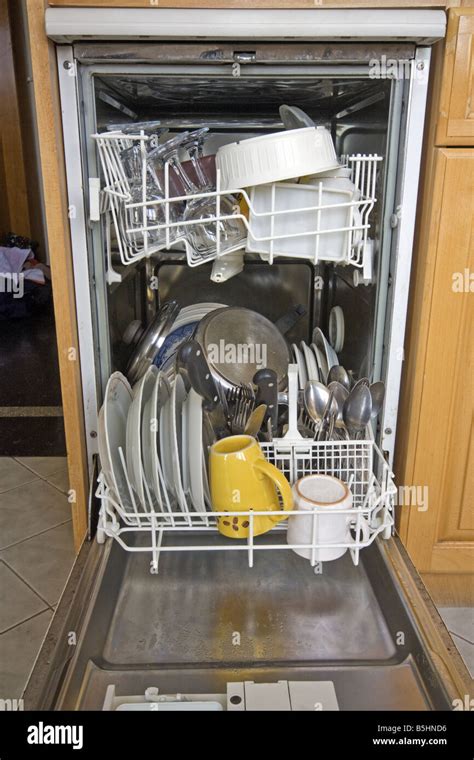 This is a domestic dishwasher full of freshly washed clean dishes ...