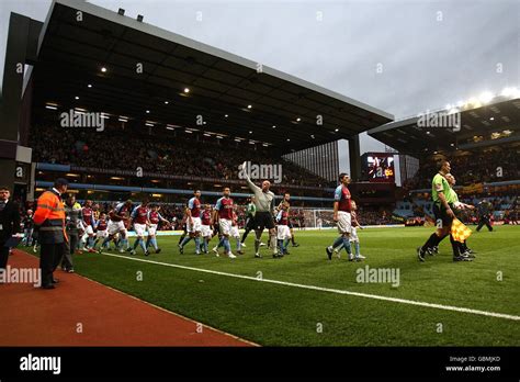 Aston Villa goalkeeper Brad Friedel (centre) waves to the crowd as the teams emerge for the ...