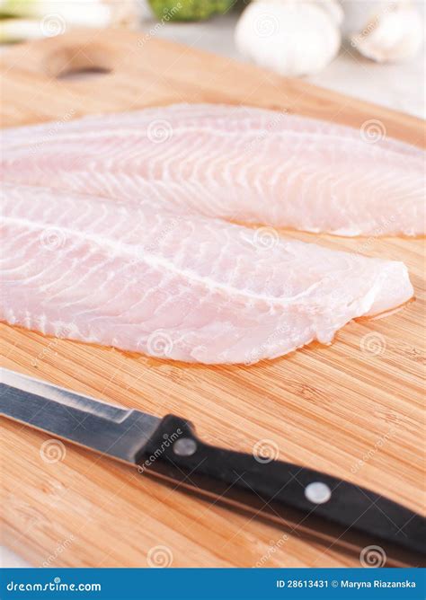 Cooking white fish fillet stock image. Image of board - 28613431