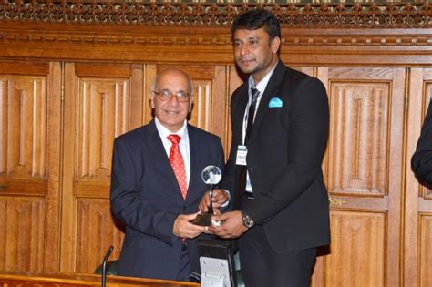 Challenging star Darshan recieves Award from British Parliament - Photos,Images,Gallery - 75993