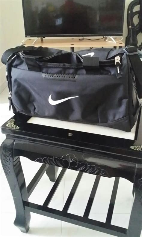 NIKE duffle bag black shoe compartment with vents, Men's Fashion, Bags, Sling Bags on Carousell