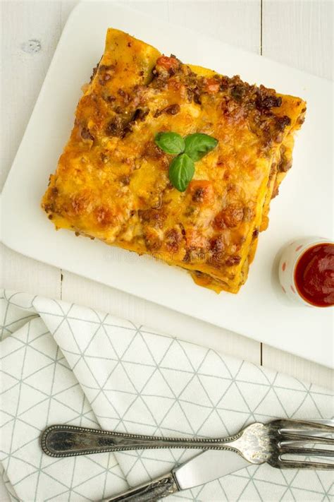 Lasagna with Minced Beef, Bolognese Sauce and Basil on Dark Plate Stock ...